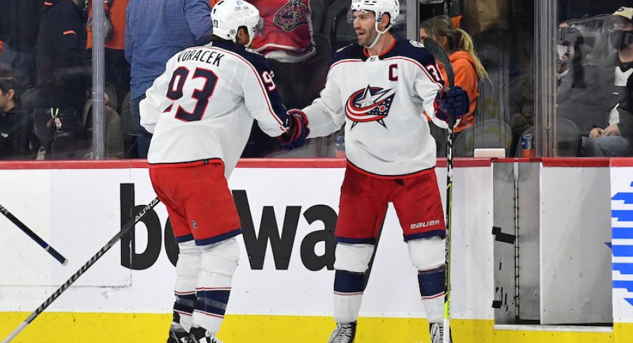 Columbus Blue Jackets' Boone Jenner and Jake Voracek celebrate their win at the Philadelphia Flyers on Thursday.