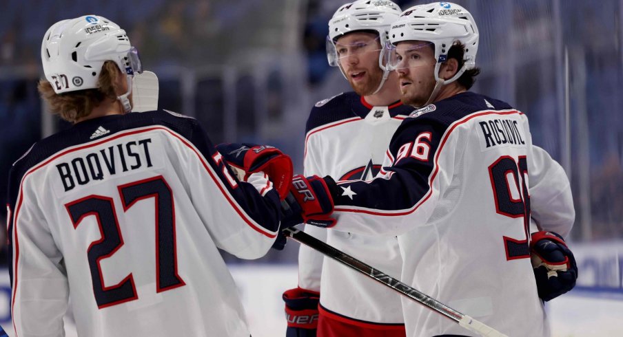 Feb 10, 2022; Buffalo, New York, USA; Columbus Blue Jackets center Jack Roslovic (96) celebrates his goal with teammates during the first period against the Buffalo Sabres at KeyBank Center.