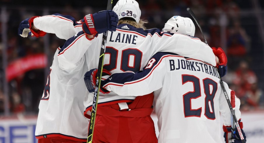 Feb 8, 2022; Washington, District of Columbia, USA; Columbus Blue Jackets left wing Patrik Laine (29) celebrates with teammates after scoring a goal against the Washington Capitals during the second period at Capital One Arena.
