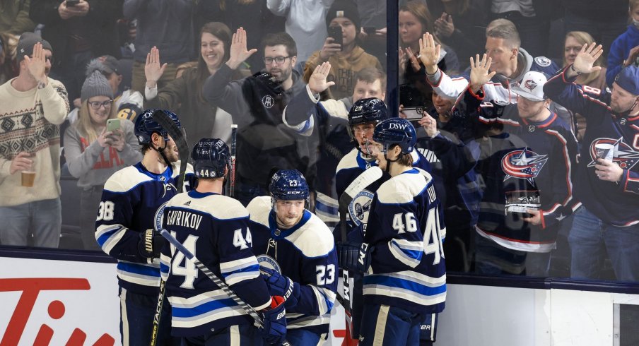 Feb 20, 2022; Columbus, Ohio, USA; Columbus Blue Jackets center Brendan Gaunce (23) celebrates with teammates after scoring a goal against the Buffalo Sabres in the second period at Nationwide Arena.