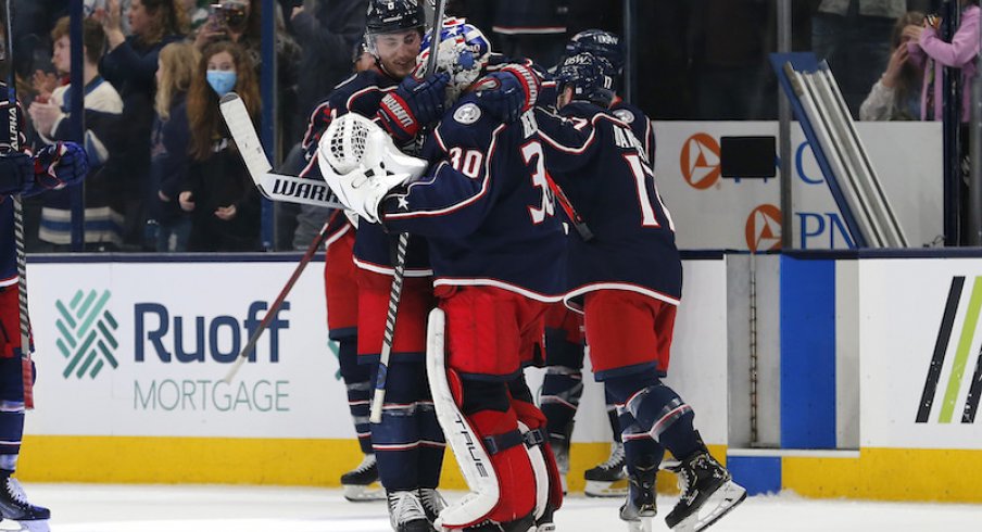 Columbus Blue Jackets' J-F Berube and teammates celebrate their win against the Toronto Maple Leafs at Nationwide Arena.