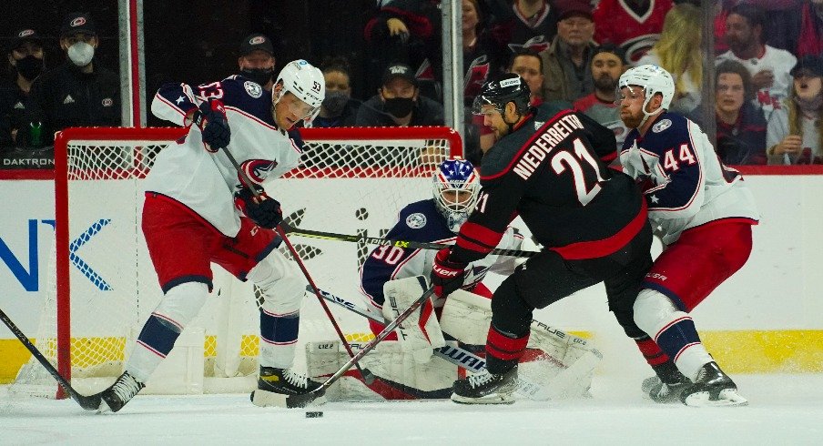 Carolina Hurricanes right wing Nino Niederreiter skates in with the puck against Columbus Blue Jackets goaltender J-F Berube defenseman Vladislav Gavrikov and defenseman Gabriel Carlsson