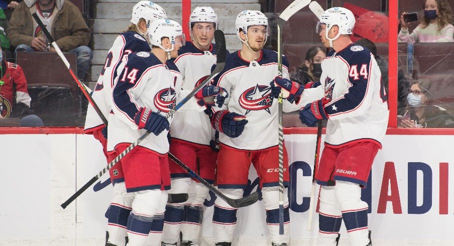 The Columbus Blue Jackets celebrate a goal scored by center Jack Roslovic in the first period against the Ottawa Senators at the Canadian Tire Centre.