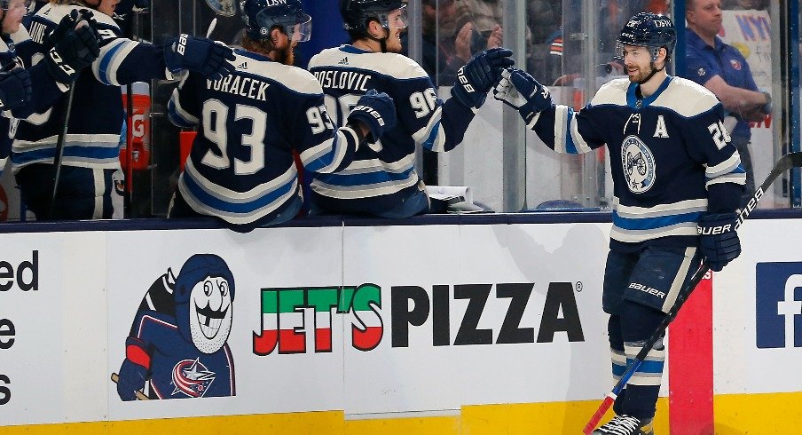 Mar 29, 2022; Columbus, Ohio, USA; Columbus Blue Jackets right wing Oliver Bjorkstrand (28) celebrates a goal against the New York Islanders during the third period at Nationwide Arena.