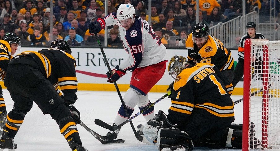 Apr 2, 2022; Boston, Massachusetts, USA; Columbus Blue Jackets left wing Eric Robinson (50) takes a shot on Boston Bruins goalie Jeremy Swayman (1) during the second period at TD Garden.