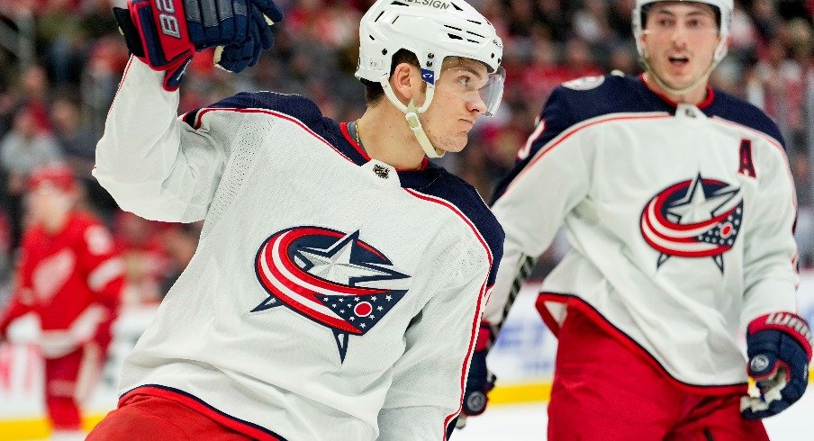 Apr 9, 2022; Detroit, Michigan, USA; Columbus Blue Jackets center Jack Roslovic (96) celebrates after scoring a goal during the first period against the Detroit Red Wings at Little Caesars Arena.