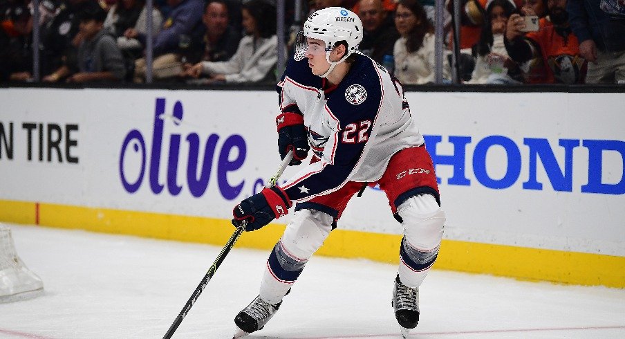 Apr 17, 2022; Anaheim, California, USA; Columbus Blue Jackets defenseman Jake Bean (22) controls the puck against the Anaheim Ducks during the second period at Honda Center.