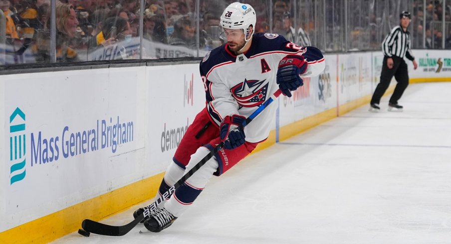 Oliver Bjorkstrand skates with the puck