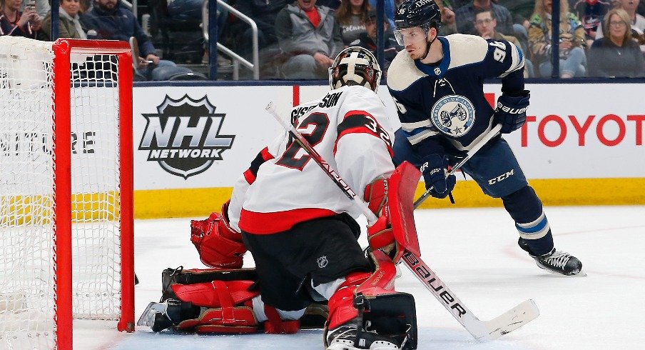 Columbus Blue Jackets center Jack Roslovic reaches for the rebound of a Ottawa Senators goalie Filip Gustavsson save during the second period at Nationwide Arena.