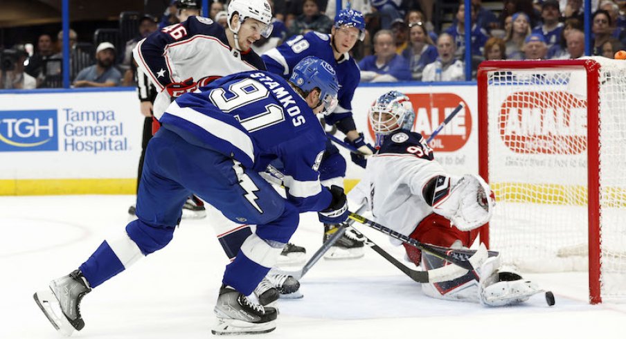 Tampa Bay Lightning's Steven Stamkos shoots on goal as Columbus Blue Jackets goaltender Elvis Merzlikins defends during the first period at Amalie Arena.
