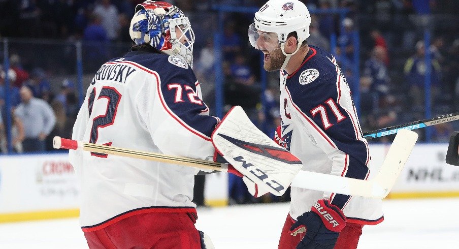 Columbus Blue Jackets goaltender Sergei Bobrovsky and left winger Nick Foligno celebrate as they beat the Tampa Bay Lightning in game one of the first round of the 2019 Stanley Cup Playoffs.