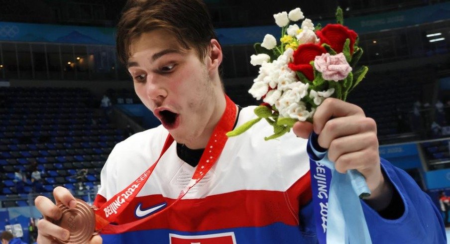 Juraj Slafkovsky celebrates after helping Slovakia earn a bronze medal in the 2022 Beijing Winter Olympics.