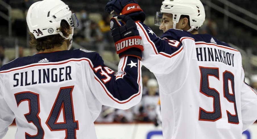 Columbus Blue Jackets' Yegor Chinakhov and Cole Sillinger celebrate a goal against the Pittsburgh Penguins during the first period at PPG Paints Arena.