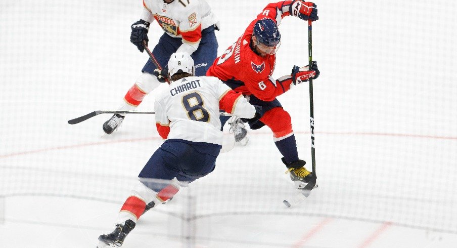 Washington Capitals left wing Alex Ovechkin skates with the puck around Florida Panthers defenseman Ben Chiarot in the third period in game three of the first round of the 2022 Stanley Cup Playoffs.