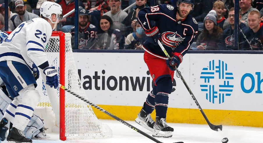 Columbus Blue Jackets center Boone Jenner passes the puck against the Toronto Maple Leafs during the first period at Nationwide Arena.