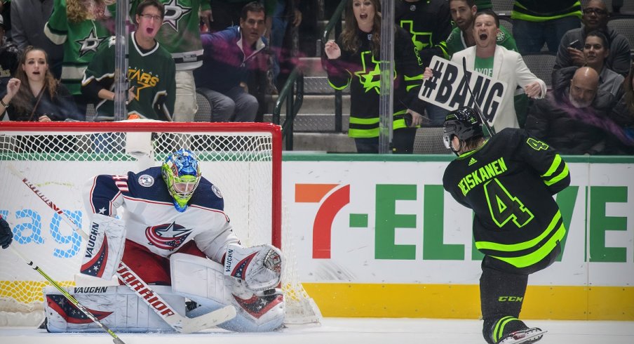 Daniil Tarasov stops a shot by Dallas Stars defenseman Miro Heiskanen