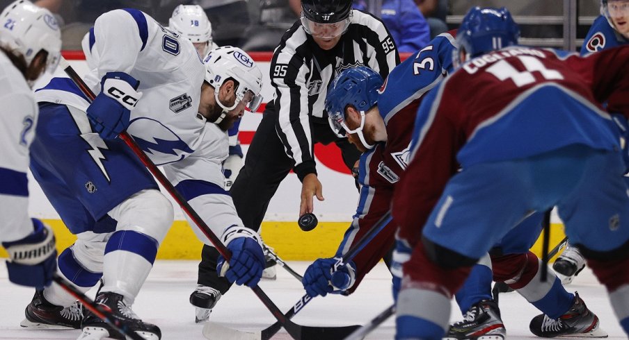 The Tampa Bay Lightning and Colorado Avalanche left wing face off during game two of the 2022 Stanley Cup Final