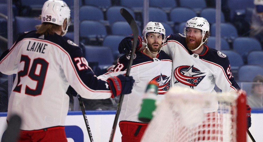 Columbus Blue Jackets right wing Oliver Bjorkstrand celebrates his goal with left wing Patrik Laine and right wing Jakub Voracek during the third period against the Buffalo Sabres.