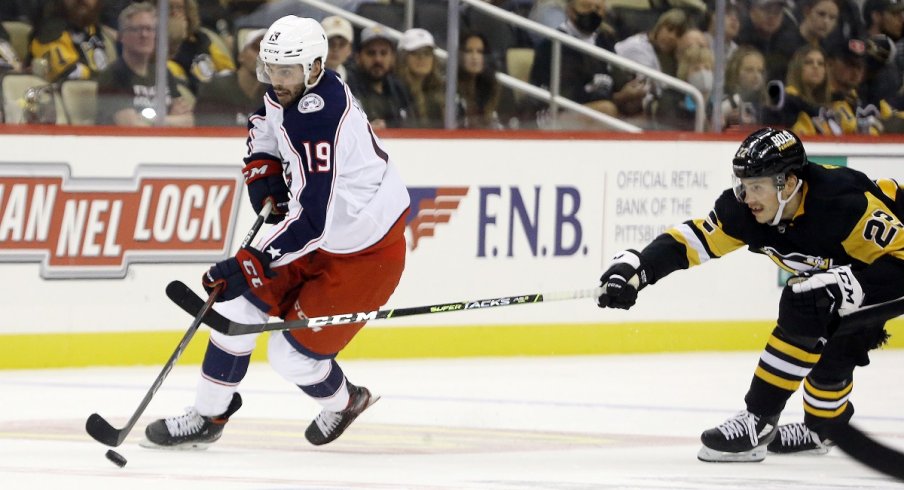 Liam Foudy skates the puck against the Pittsburgh Penguins