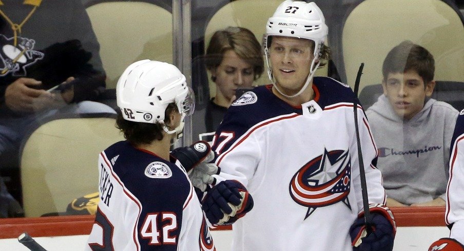 Columbus Blue Jackets defenseman Adad Boqvist celebrates with center Alexandre Texier after scoring a goal against the Pittsburgh Penguins during the third period at PPG Paints Arena.