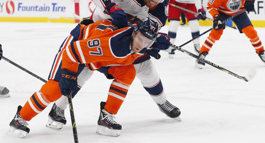 Vladislav Gavrikov defending Connor McDavid