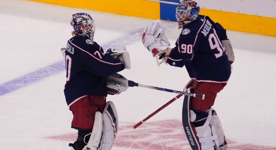 Columbus Blue Jackets goaltender Joonas Korpisalo  heads for the bench as he is replaced by goaltender Elvis Merzlikins during the second period against the Toronto Maple Leafs in the Eastern conference play-in game.