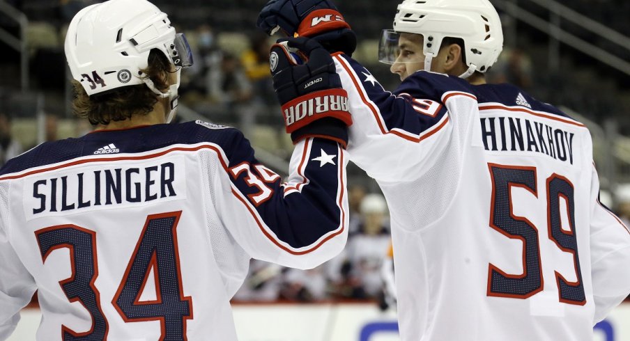 Yegor Chinakhov celebrates with Cole Sillinger after scoring a goal 