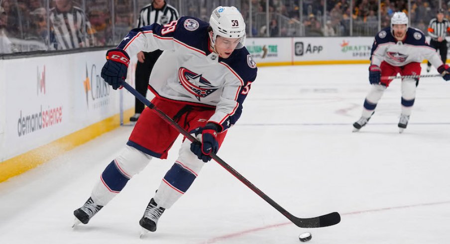 Columbus Blue Jackets' Yegor Chinakhov controls the puck against the Boston Bruins during the second period at TD Garden.