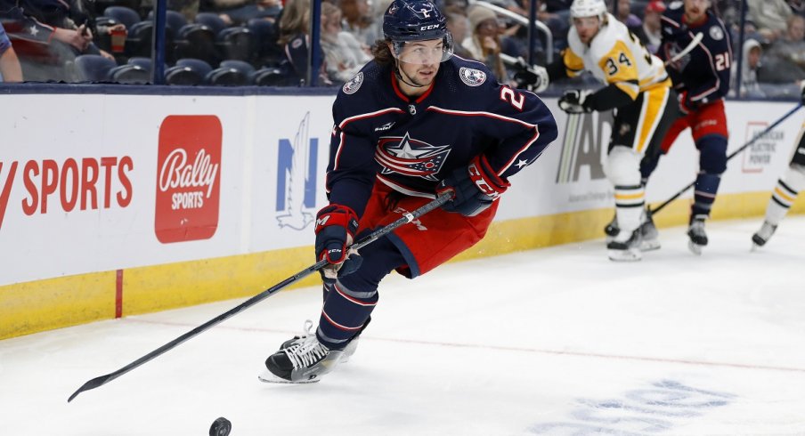 Andrew Peeke looks to pass the puck against the Pittsburgh Penguins at Nationwide Arena