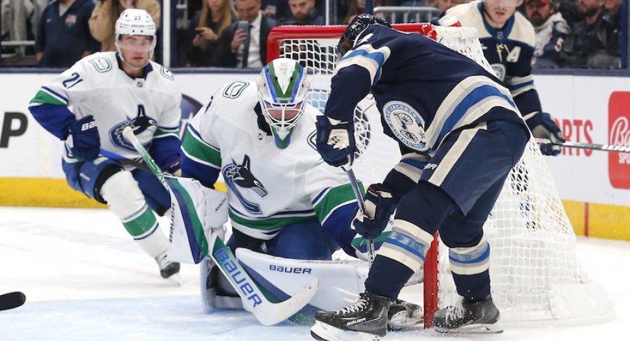 Vancouver Canucks goalie Spencer Martin makes a save against Columbus Blue Jackets defenseman Nick Blankenburg during the second period at Nationwide Arena.