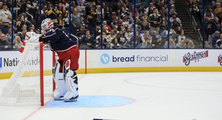 Columbus Blue Jackets' Elvis Merzlikins reacts after allowing a goal against the Pittsburgh Penguins in the third period at Nationwide Arena.