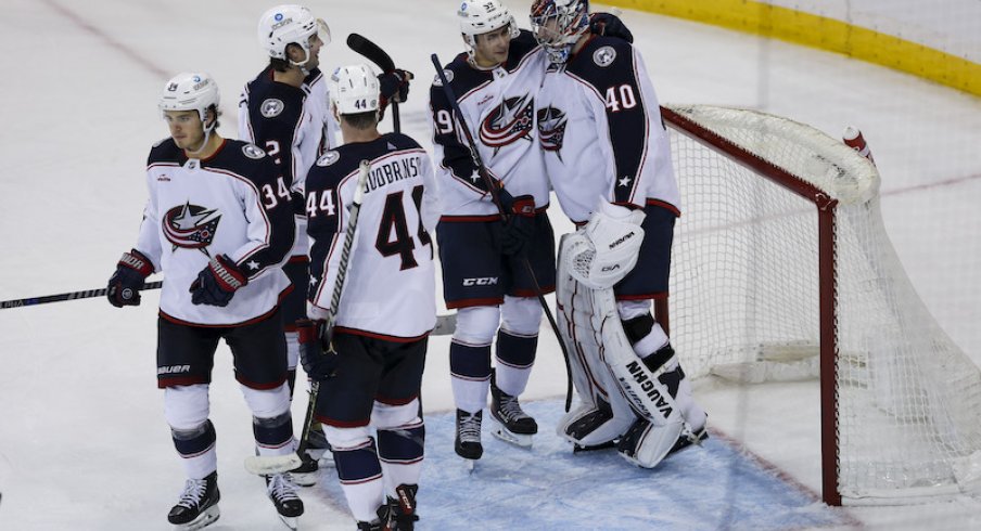 Columbus Blue Jackets' Yegor Chinakhov celebrates with Columbus Blue Jackets' Daniil Tarasov after defeating the New York Rangers at Madison Square Garden.