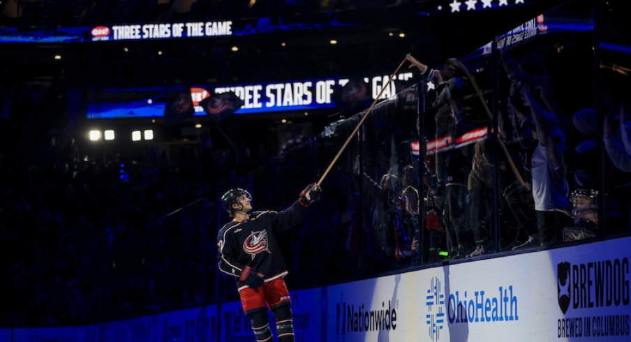 Columbus Blue Jackets' Nick Blankenburg tosses a stick into the crowd after the game the Nashville Predators at Nationwide Arena.