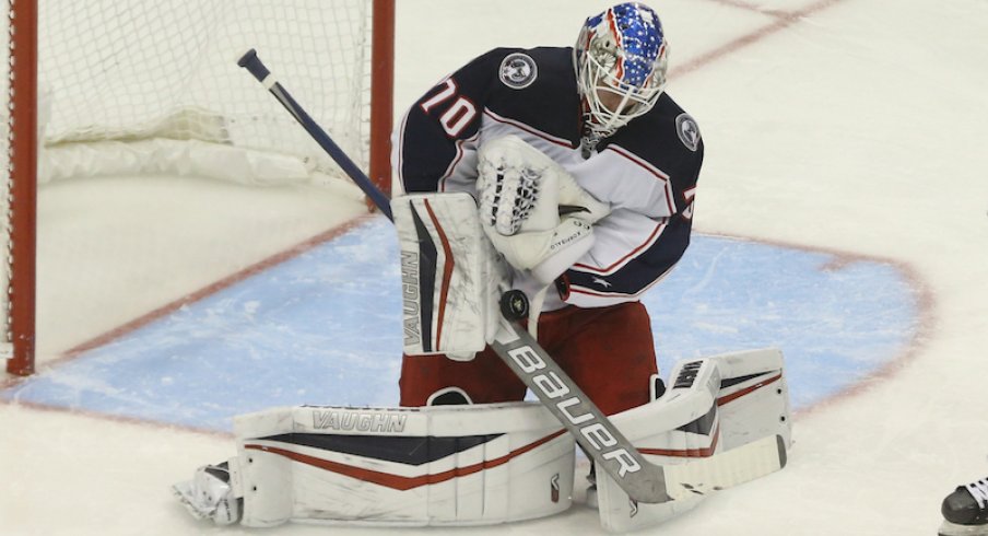 Columbus Blue Jackets' Joonas Korpisalo makes a save against the Pittsburgh Penguins during the second period at PPG Paints Arena.