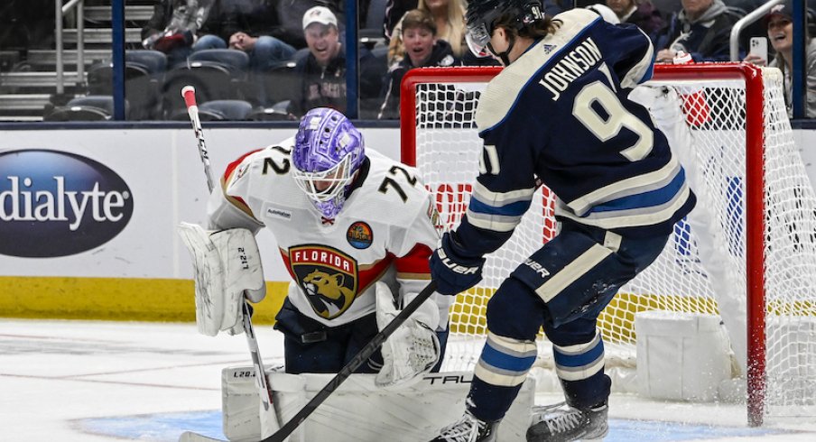 Florida Panthers' Sergei Bobrovsky makes a save on Columbus Blue Jackets' Kent Johnson in the third period at Nationwide Arena.