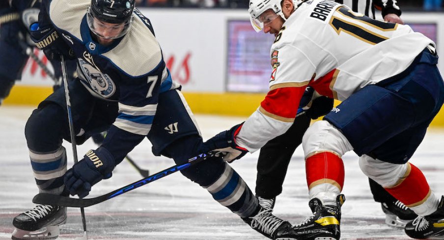 Columbus Blue Jackets' Sean Kuraly wins a face-off against Florida Panthers' Aleksander Barkov in the first period at Nationwide Arena.