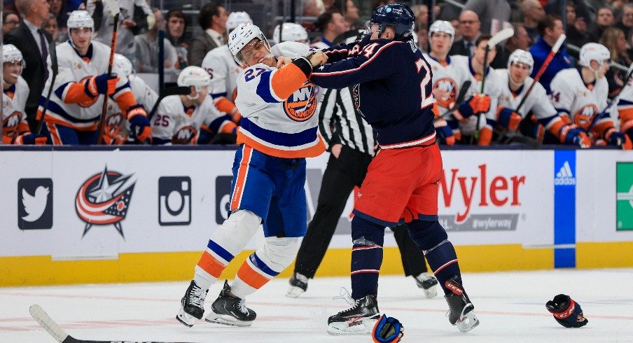 New York Islanders left wing Anders Lee fights with Columbus Blue Jackets right wing Mathieu Olivier in the second period at Nationwide Arena.