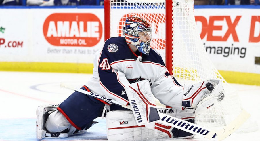 Columbus Blue Jackets' Daniil Tarasov makes a save against the Tampa Bay Lightning during the third period at Amalie Arena.