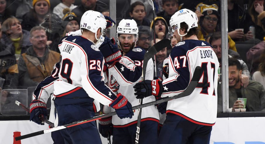 Columbus Blue Jackets' Boone Jenner celebrates his goal with his teammates during the second period against the Boston Bruins at TD Garden.