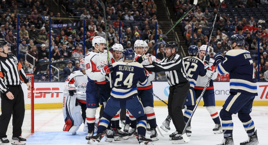 Columbus Blue Jackets' Mathieu Olivier scrums with members of the Washington Capitals in the second period at Nationwide Arena.