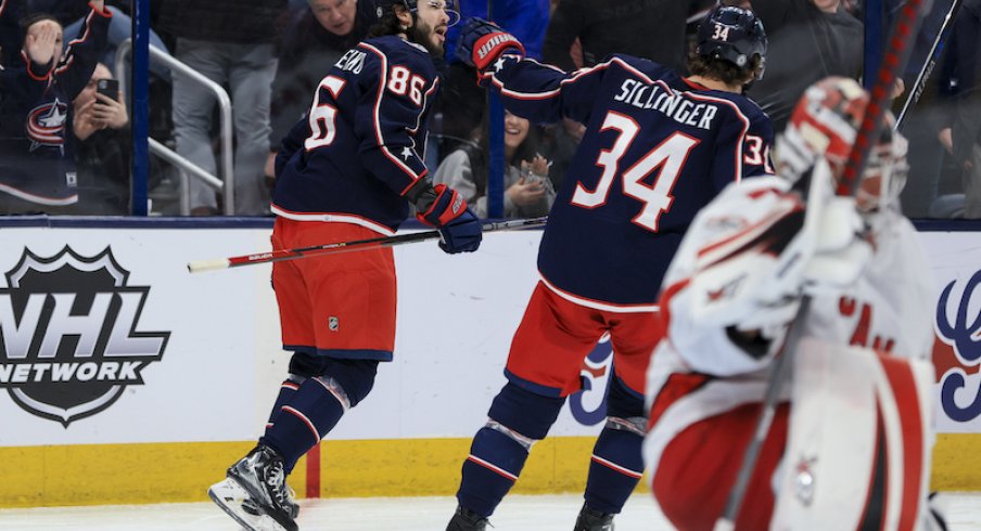 Columbus Blue Jackets' Kirill Marchenko celebrates with teammates after scoring a goal against the Carolina Hurricanes in the second period at Nationwide Arena.