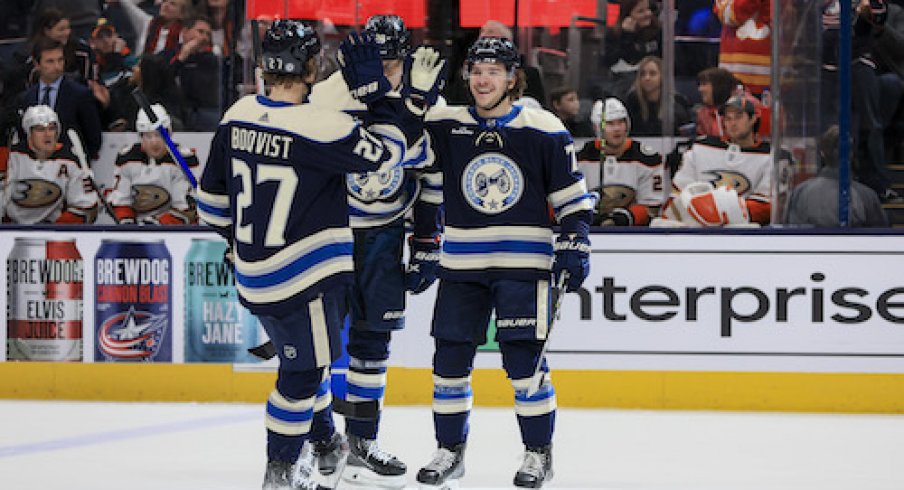 Adam Boqvist, Patrik Laine, and Nick Blankenburg