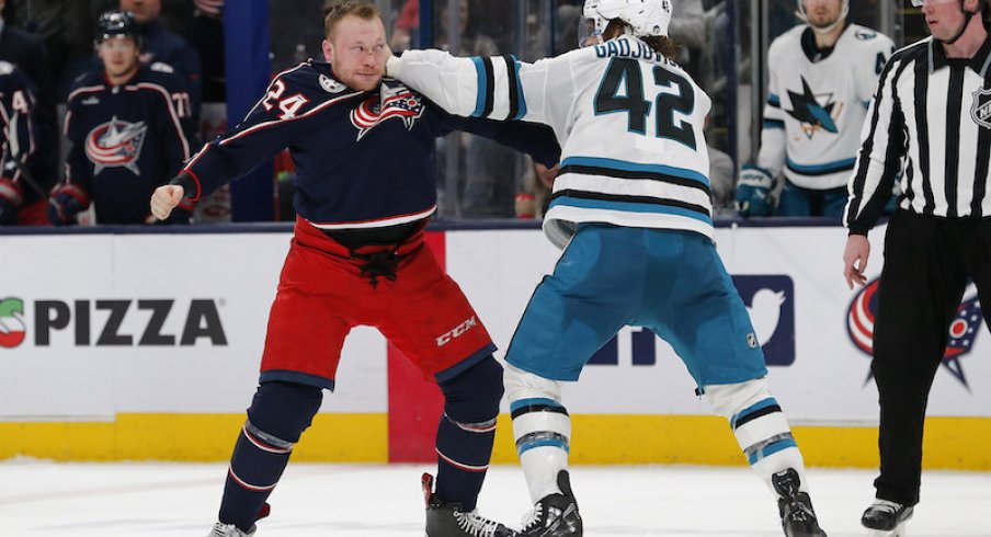 Columbus Blue Jackets' Mathieu Olivier and San Jose Sharks' Jonah Gadjovich fight during the second period at Nationwide Arena.