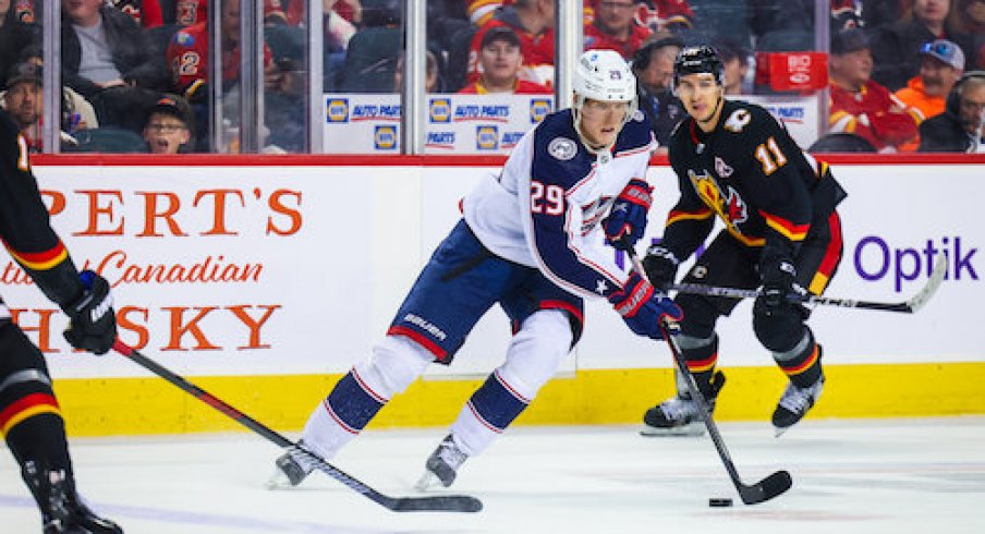 Patrik Laine skates with the puck in the Blue Jackets' contest against the Calgary Flames.