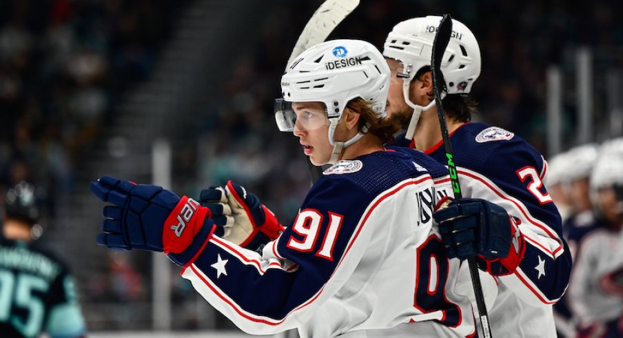 The Columbus Blue Jackets celebrate after Kent Johnson scored a goal against the Seattle Kraken during the second period at Climate Pledge Arena.