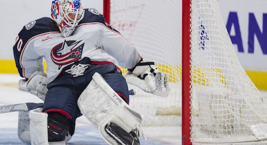 Joonas Korpisalo makes a save in the Blue Jackets' game against the Vancouver Canucks.