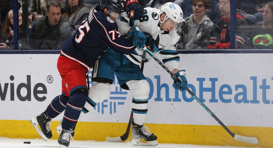Columbus Blue Jackets' Tim Berni checks San Jose Sharks' Timo Meier during the second period at Nationwide Arena.