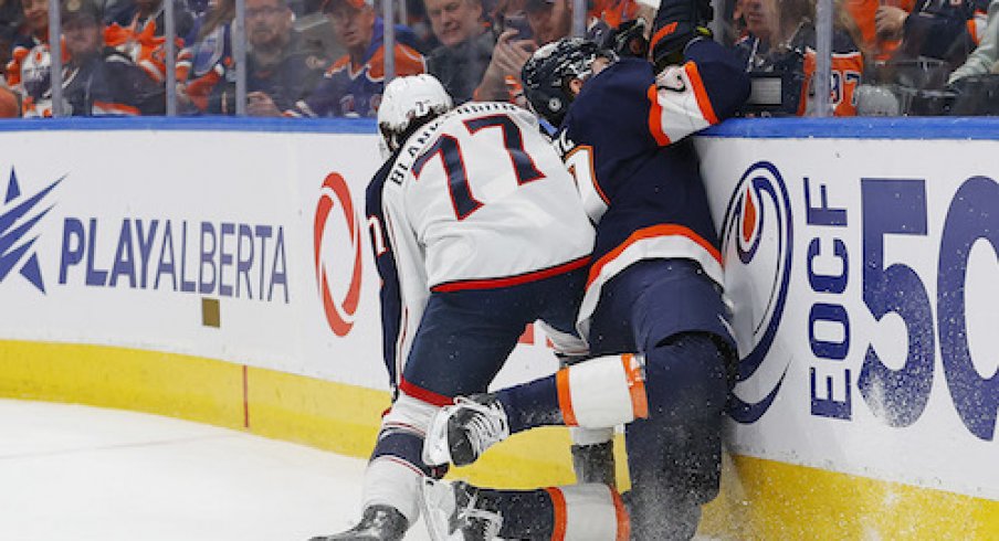 Nick Blankenburg checks Leon Draisaitl in the Blue Jackets vs. Oilers game.