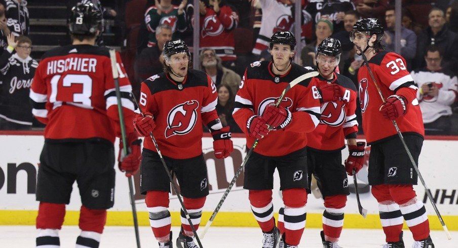 The New Jersey Devils team skates out on the ice after the winning