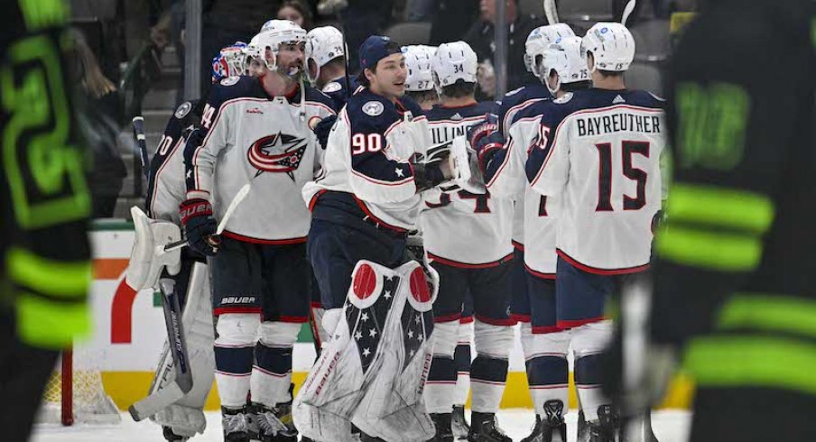 Columbus Blue Jackets' Elvis Merzlikins and Blue Jackets celebrate the win over the Dallas Stars at the American Airlines Center.
